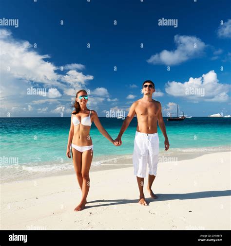 Couple on a beach at Maldives Stock Photo - Alamy