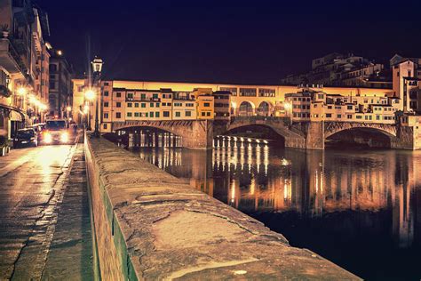 The Ponte Vecchio at night Photograph by Marc Henderson - Pixels