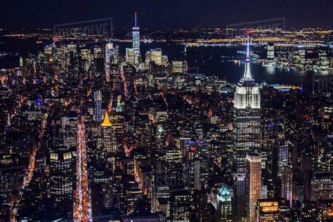 USA, New York, New York City, Manhattan, Aerial view of illuminated skyline at night - Stock ...