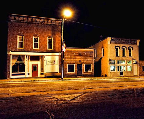 Town Street At Night Photograph by Jeffrey Platt