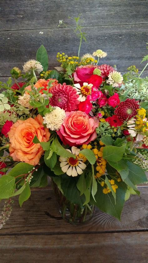 Seasonal summer flower arrangement featuring Roses, Dahlias, Zinnias, Scabiosa and more ...