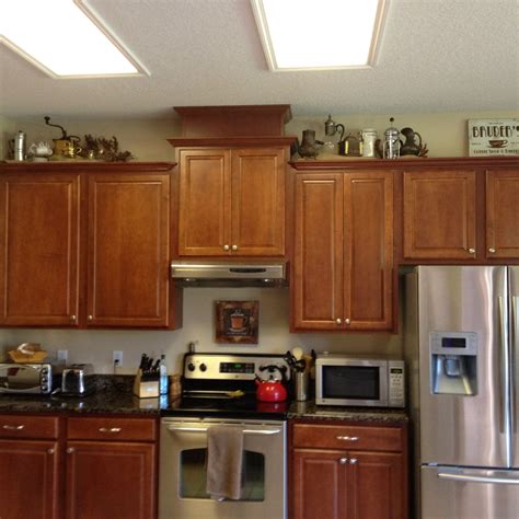 Coffee-themed decor above cabinets (With images) | Home decor kitchen, Cafe kitchen decor