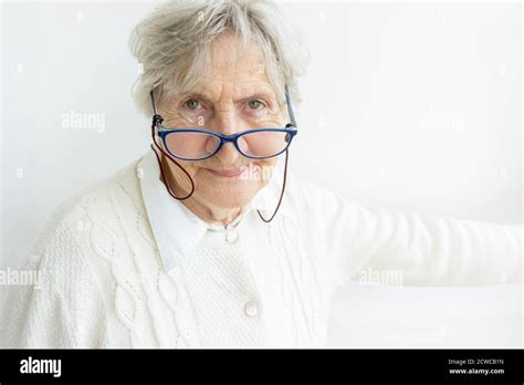 older woman in white with glasses – Telegraph