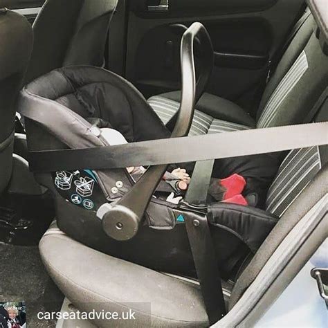 Reposted from @carseatadvice.uk - Fitting an infant carrier car seat with the seat belt is just ...