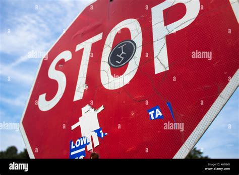 Stop sign with graffiti on it Stock Photo - Alamy