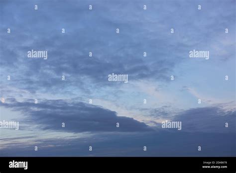 Evening sky with clouds and moon Stock Photo - Alamy