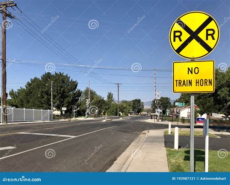 Yellow Railroad Crossing Sign in Front of Tracks Editorial Photo - Image of outside, yellow ...