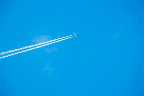 Premium Photo | Trail of jet plane on blue sky