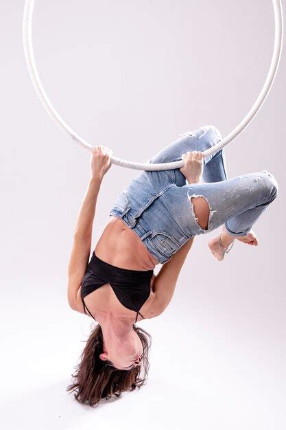 Premium Photo | A female aerial hoop gymnast performing exercises on an aerial hoop