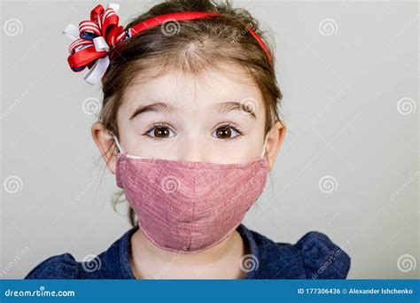 Little Girl Has Fabric Mask Protect Herself from Coronavirus COVID-19 Stock Photo - Image of ...