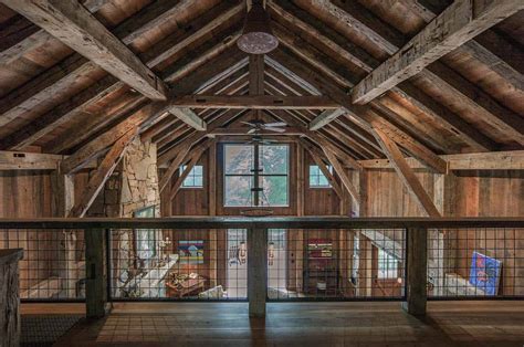 Timber frame barn house showcases inviting interiors in North Carolina