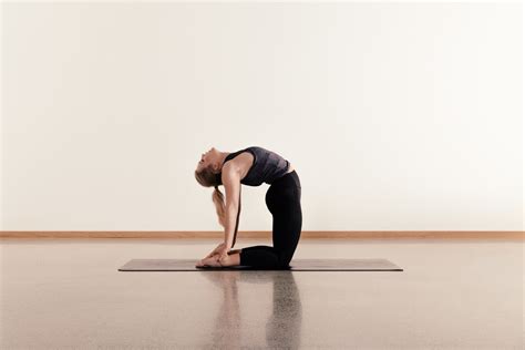 yoga – camel pose. - here. wellbeing - here. wellbeing