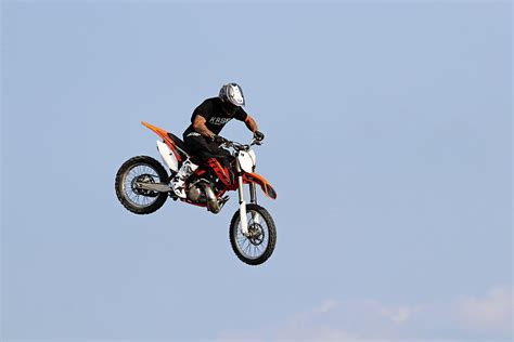 Dirt Bike Stunts - In The Air II Photograph by Debbie Oppermann - Fine Art America