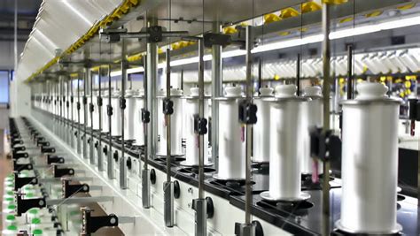 Textile Industry. Row Of Automated Machines For Yarn Manufacturing. Yarn Thread Running In The ...