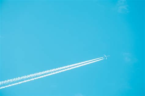 Premium Photo | Trail of jet plane on blue sky