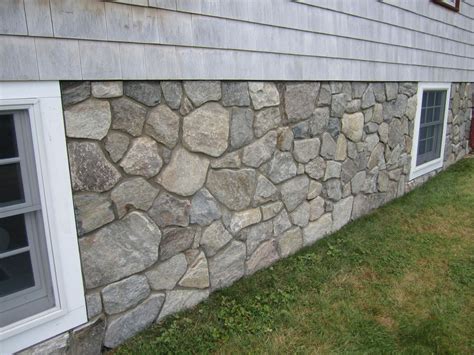 Stone veneer transforms concrete foundation | Stone facade, Exterior stone, Stone panels exterior