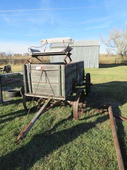 OLD WOODEN WAGON WITH STEEL WHEELS ALSO INCLUDES 4 RUBBER WHEELS WAGON IS APPROX. 37" WIDE X 128 ...