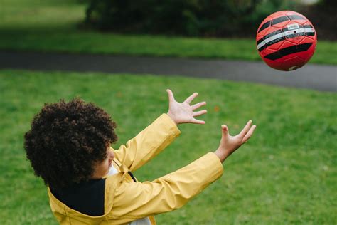 Careful black boy catching ball · Free Stock Photo