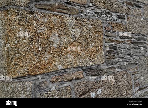 Granite and stone building wall Stock Photo - Alamy