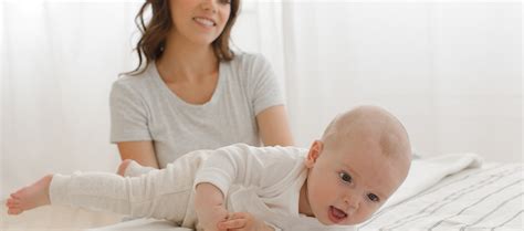 When Do Babies Roll Over? How to Encourage It | Pampers