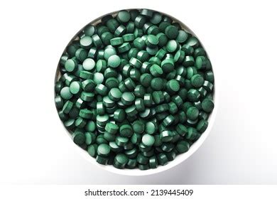 Spirulina Chlorella Tablets On Light Background Stock Photo 2139445409 | Shutterstock