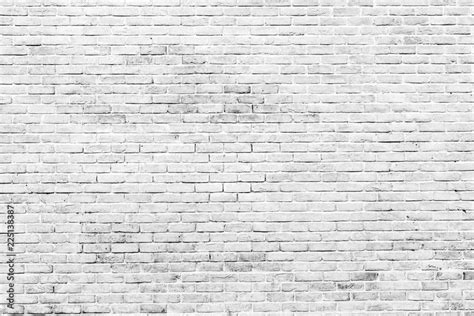 White and grey brick wall texture background with space for text. White bricks wallpaper. Home ...