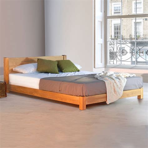 low oriental space saver wooden bed frame by get laid beds | notonthehighstreet.com