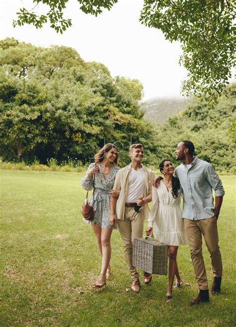 Friends walking together in the park – Jacob Lund Photography Store- premium stock photo