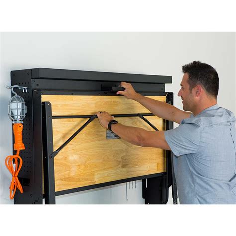 The Wall Mounted Folding Workbench - Hammacher Schlemmer