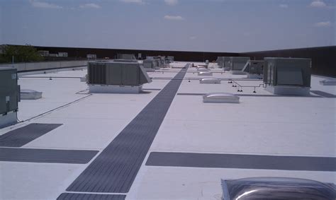 TPO Flat roof with walk pads - Brinkmann Quality Roofing Services | Flat roof, Membrane roof ...