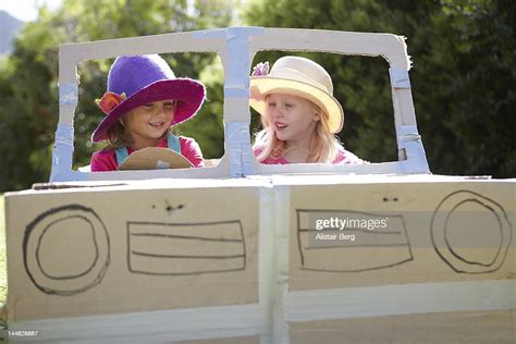 Children Playing Together In A Cardboard Car High-Res Stock Photo - Getty Images