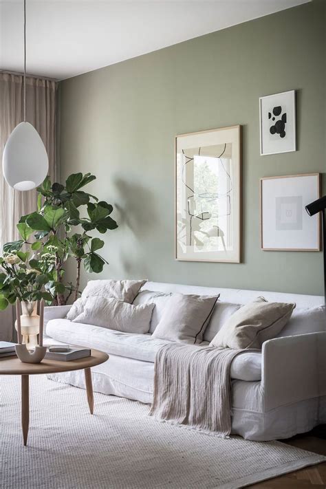 Minimalist living room with sage green walls | Decoración de unas, Colores de casas interiores ...