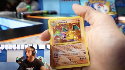 Logan Paul Charizard / Logan Paul mindblown after pulling rare Pokemon cards ... / A first ...