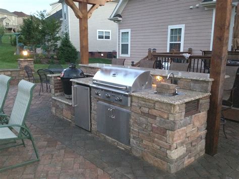 Island with smoker, fridge, 36" grill, sink and a bar ledge that is 11' long | Outdoor kitchen ...