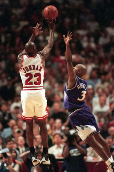 What Pros Wear: Michael Jordan Sinks Buzzer Beater in NBA Finals Wearing the Air Jordan 12 Shoes ...