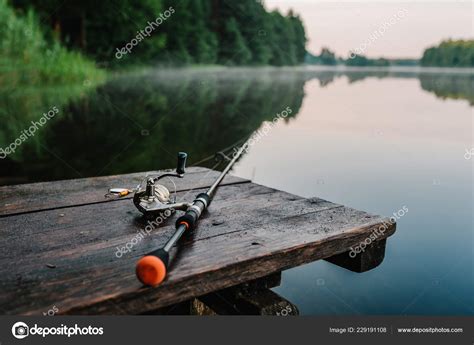 Fishing Rod Spinning Reel Background Pier River Bank Sunrise Fog ⬇ Stock Photo, Image by ...