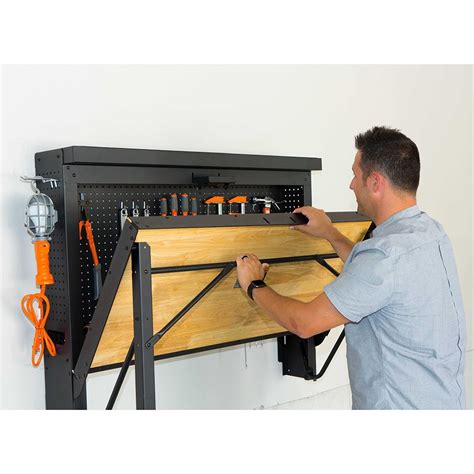 The Wall Mounted Folding Workbench - Hammacher Schlemmer