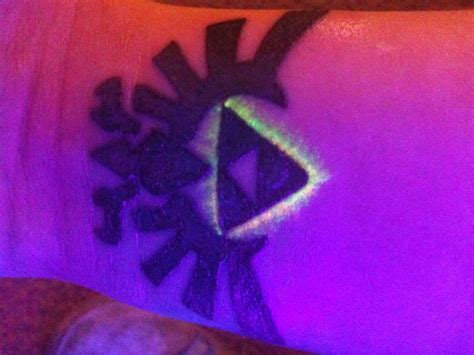 Hyrule crest tattoo under the blacklight :D by allisynVengeance on DeviantArt