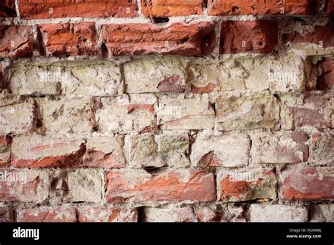 Background of cracked brick wall texture Stock Photo - Alamy