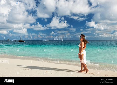 Couple on a beach at Maldives Stock Photo - Alamy