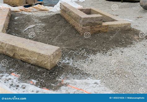 Building a a Stone Wall with Red Granite during a Landscape Construction Job Stock Photo - Image ...