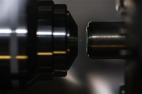 Experiments with optical tweezers race to test the laws of quantum mechanics