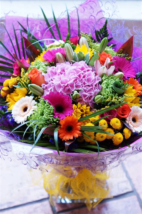 A stunning vibrant summer flower bouquet, including a beautiful pink hydrangea in the centre. # ...