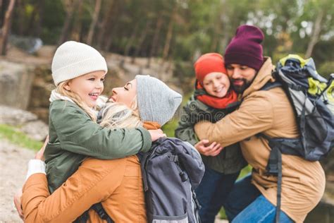 Parents hugging children stock photo. Image of parenthood - 103065580