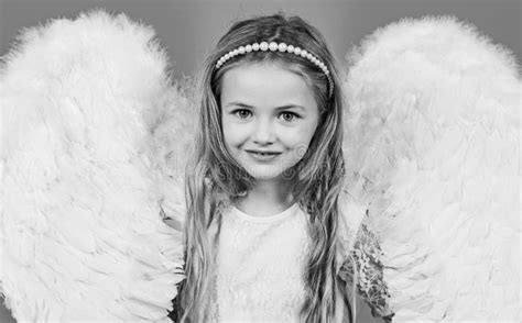 Wonderful Blonde Little Girl in the Image of an Angel with White Wings. Angel Kid with Blonde ...