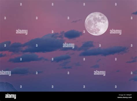 Evening sky with clouds and full moon Stock Photo - Alamy