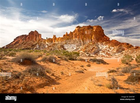 Spectacular Australian outback desert landscape with golden rocky outcrop at Rainbow Valley ...