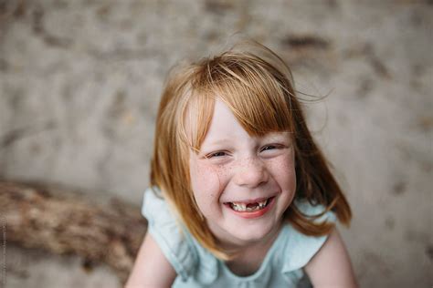 "Portrait Of A Little Girl Missing Her Two Front Teeth" by Stocksy Contributor "Amanda Voelker ...