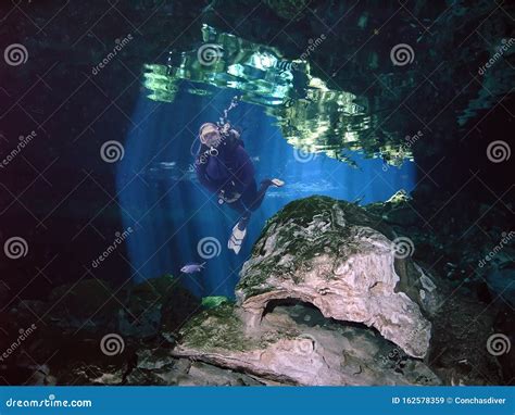 A SCUBA Diver Fins through a Yucatan Cenote Stock Image - Image of limestone, mexico: 162578359