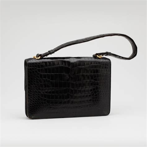 HERMÈS, a black crocodile leather shoulder bag. - Bukowskis